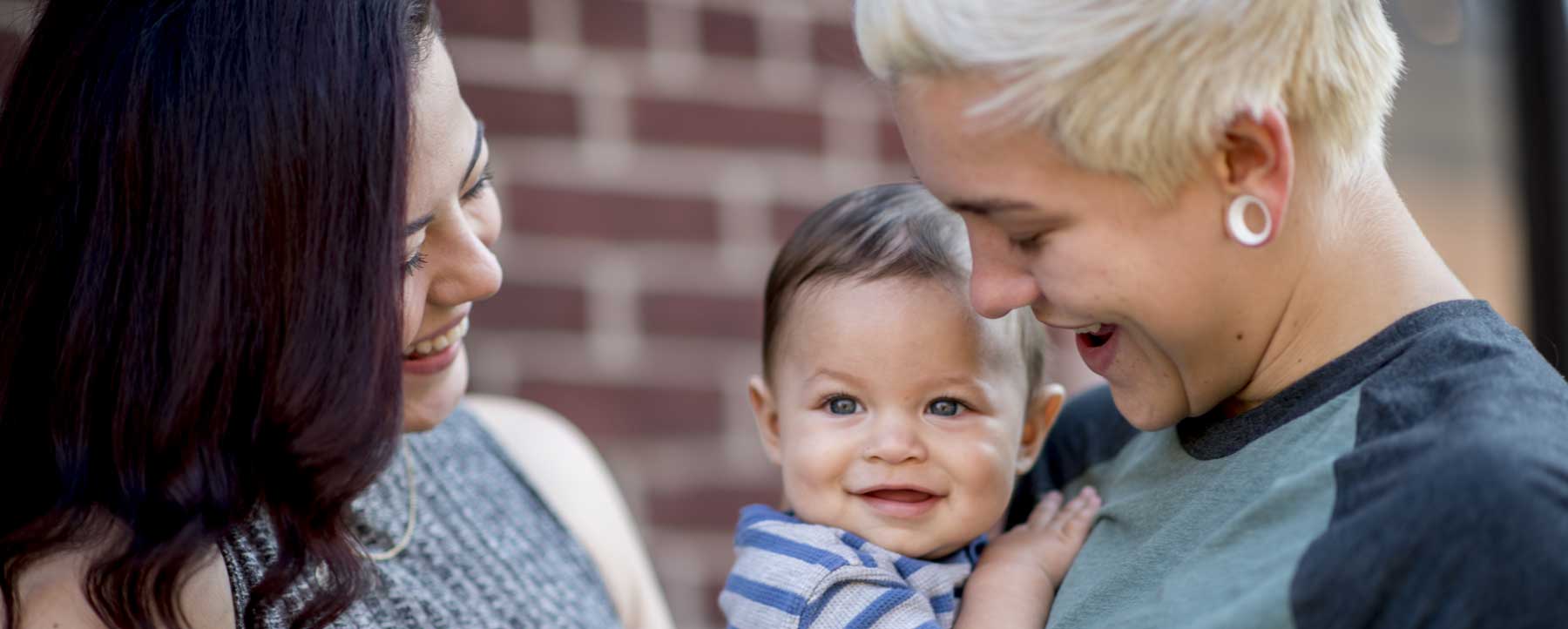 family holding baby